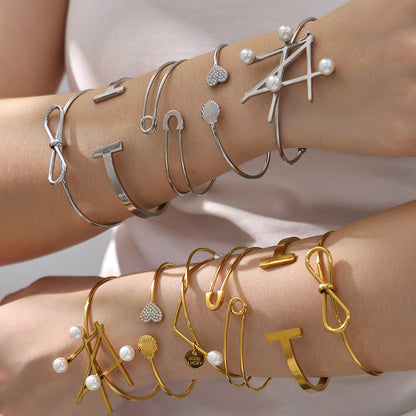 Hands stacked with gold & silver geometric line open bangle set, European-American high-end style