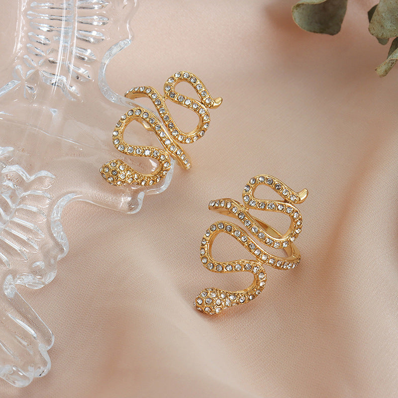 Gold snake statement ring with clear cubic zirconia product display