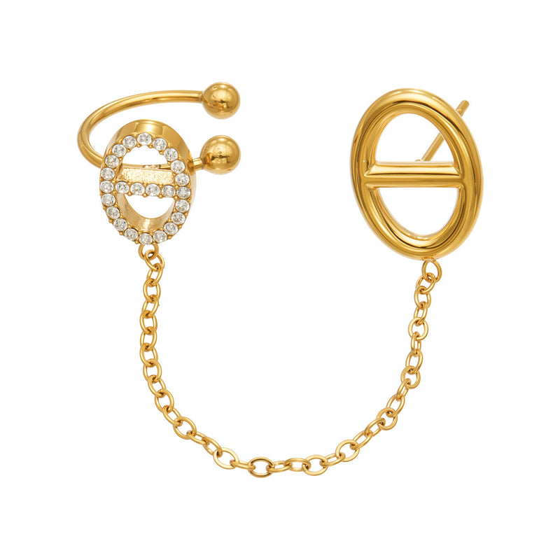 Gold-tone stainless steel ear cuff with sparkling stone accents, geometric oval stud and connecting chain