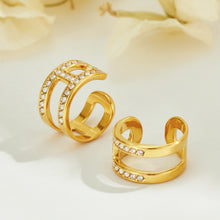 Gold-tone stainless steel ear cuffs with clear rhinestone accents displayed together