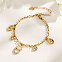 Gold stainless steel zircon geometric charm bracelet on white background