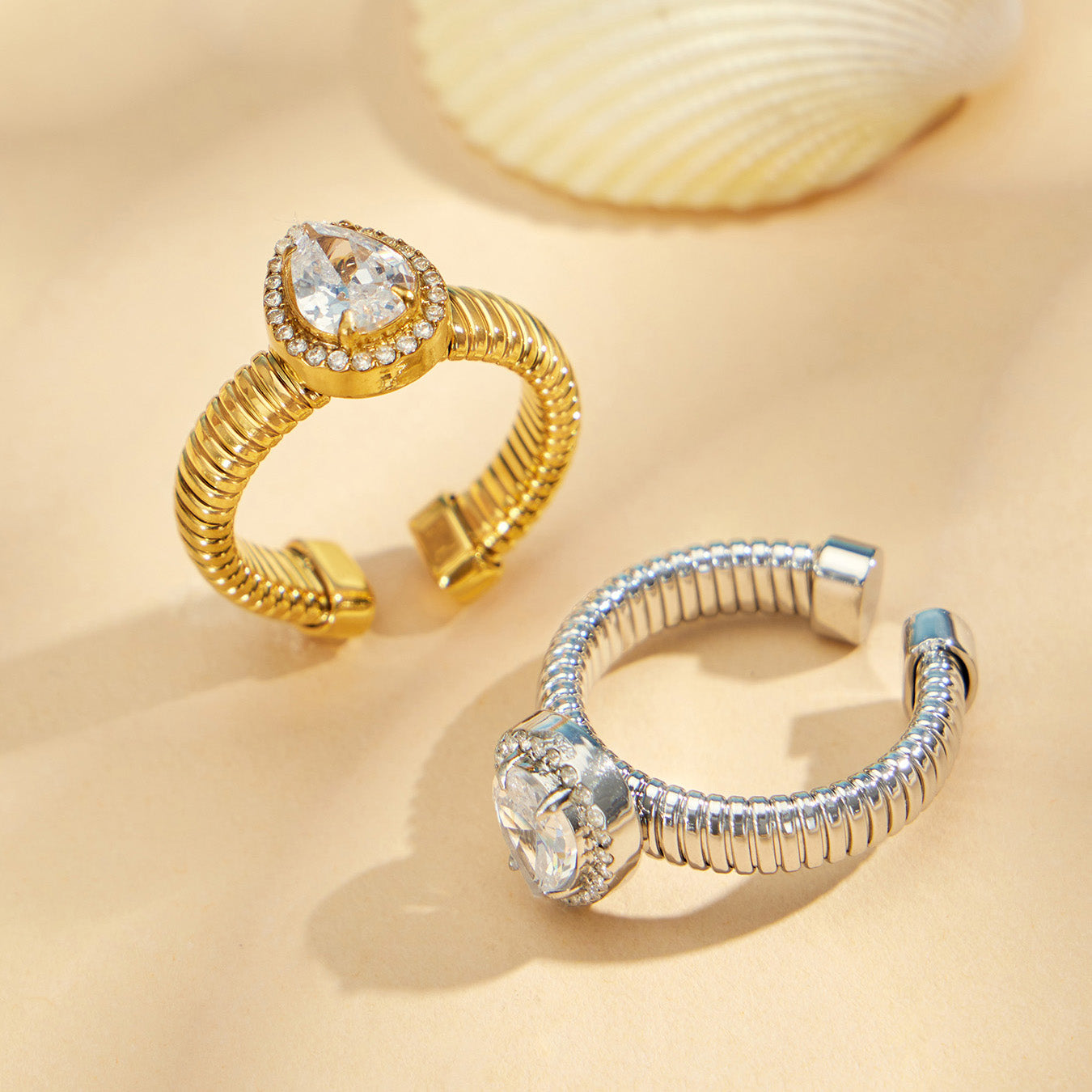 Gold 5A zircon open rings displayed with shell, featuring waterdrop, round and square geometric ring styles