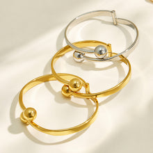 Gold and polished steel double ball cuff bracelet finish options displayed together