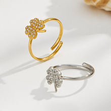Gold and steel 316L stainless steel floral CZ open rings displayed together on a light background