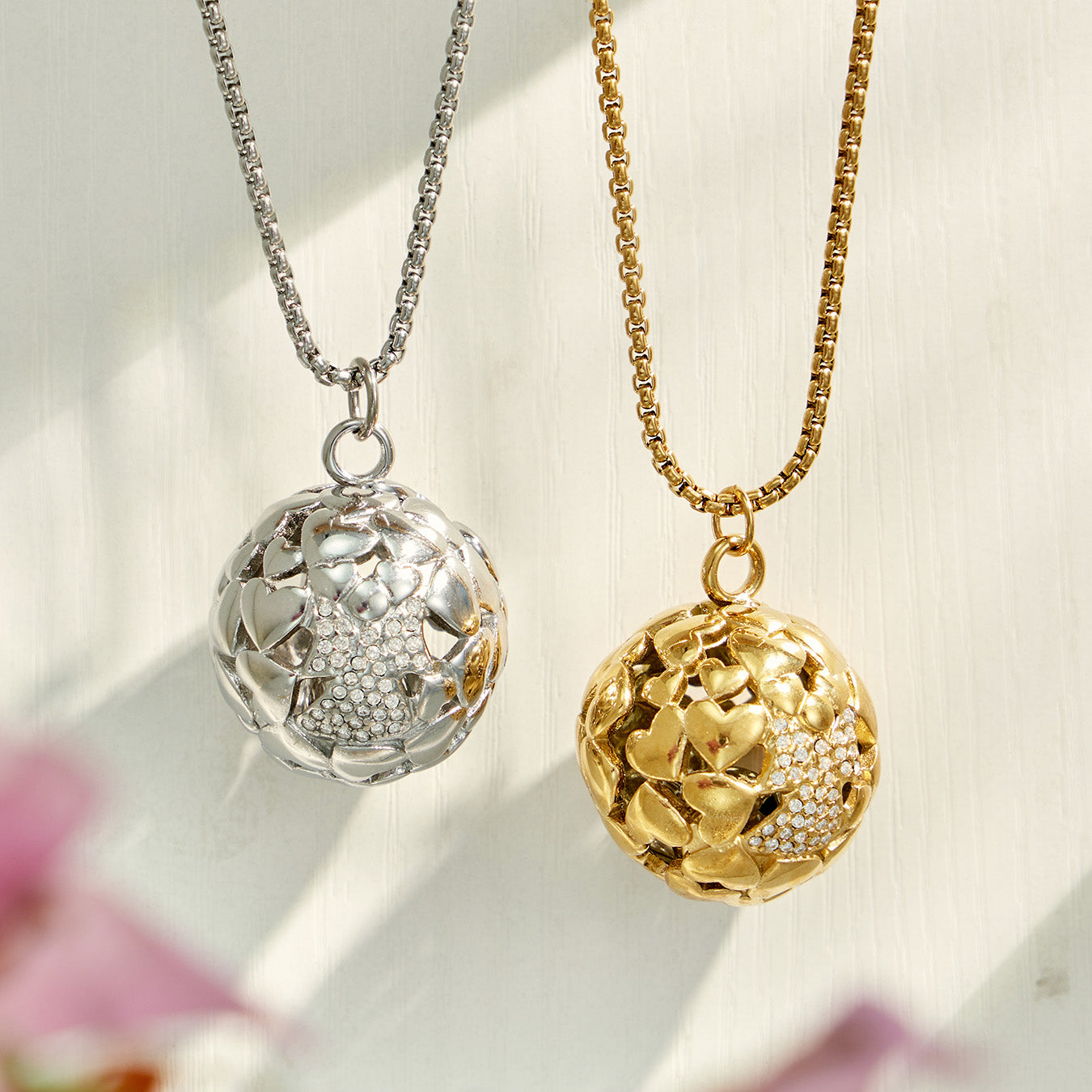 Gold and polished steel round medallion necklace finish options displayed together