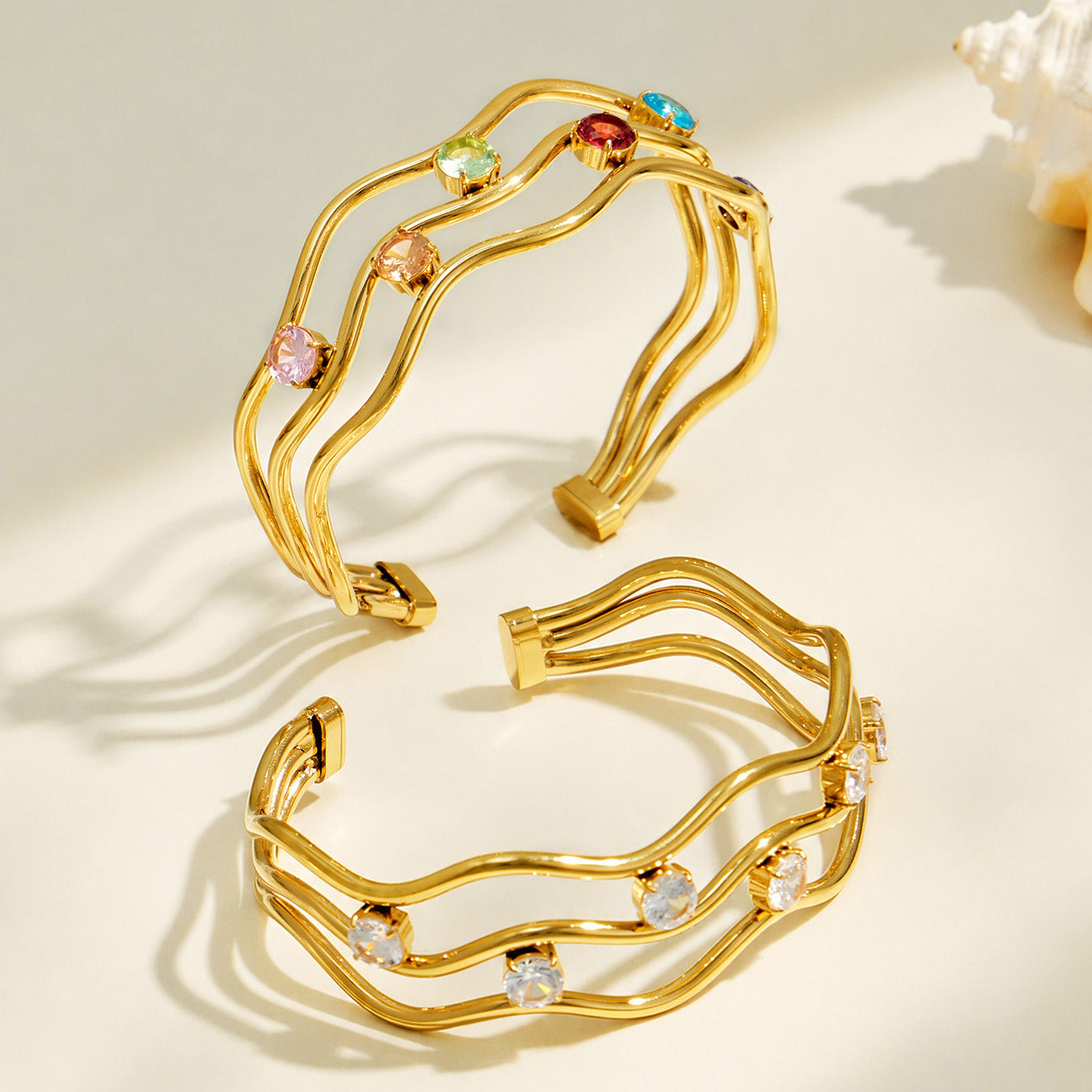 Gold three-layer open bangle with layered curved design