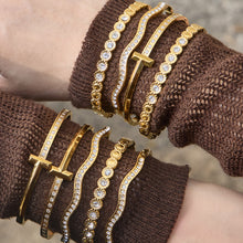 Gold zircon bangle bracelet stack on brown knit sleeve with H buckle cuff, wavy zircon bangle and round zircon bracelet