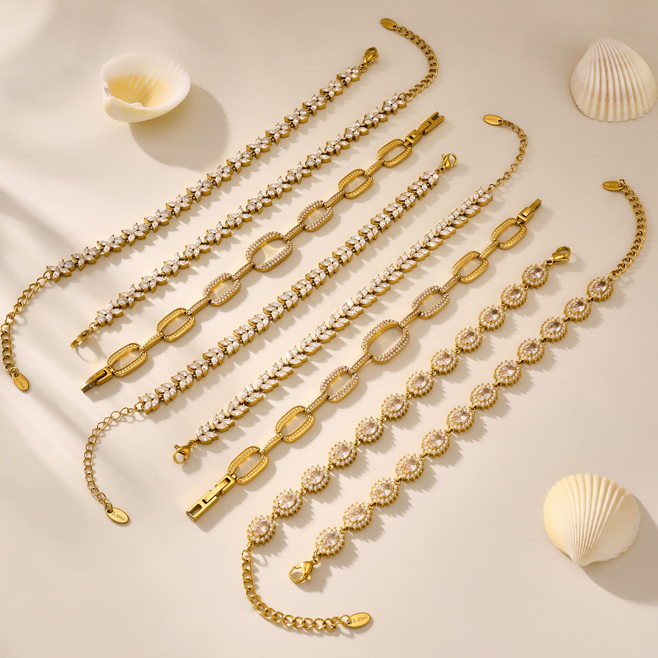 Gold zircon bracelet assortment with tennis, floral and link chain designs