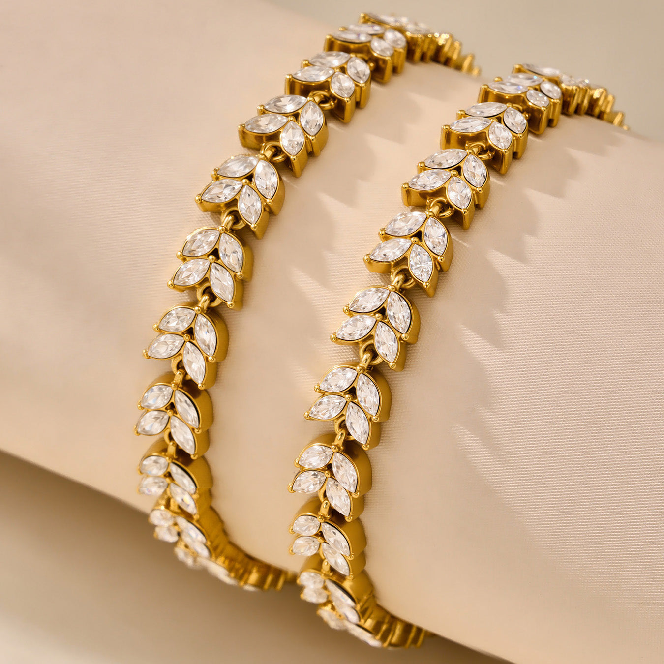 Gold floral zircon tennis bracelets shown together in a close-up product display