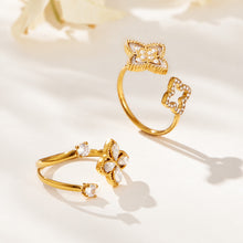 Two gold-tone open ring designs with floral zircon details displayed side by side