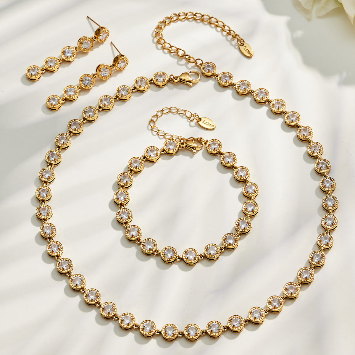 Gold zircon jewelry set flat lay
