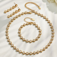 Gold zircon jewelry set flat lay