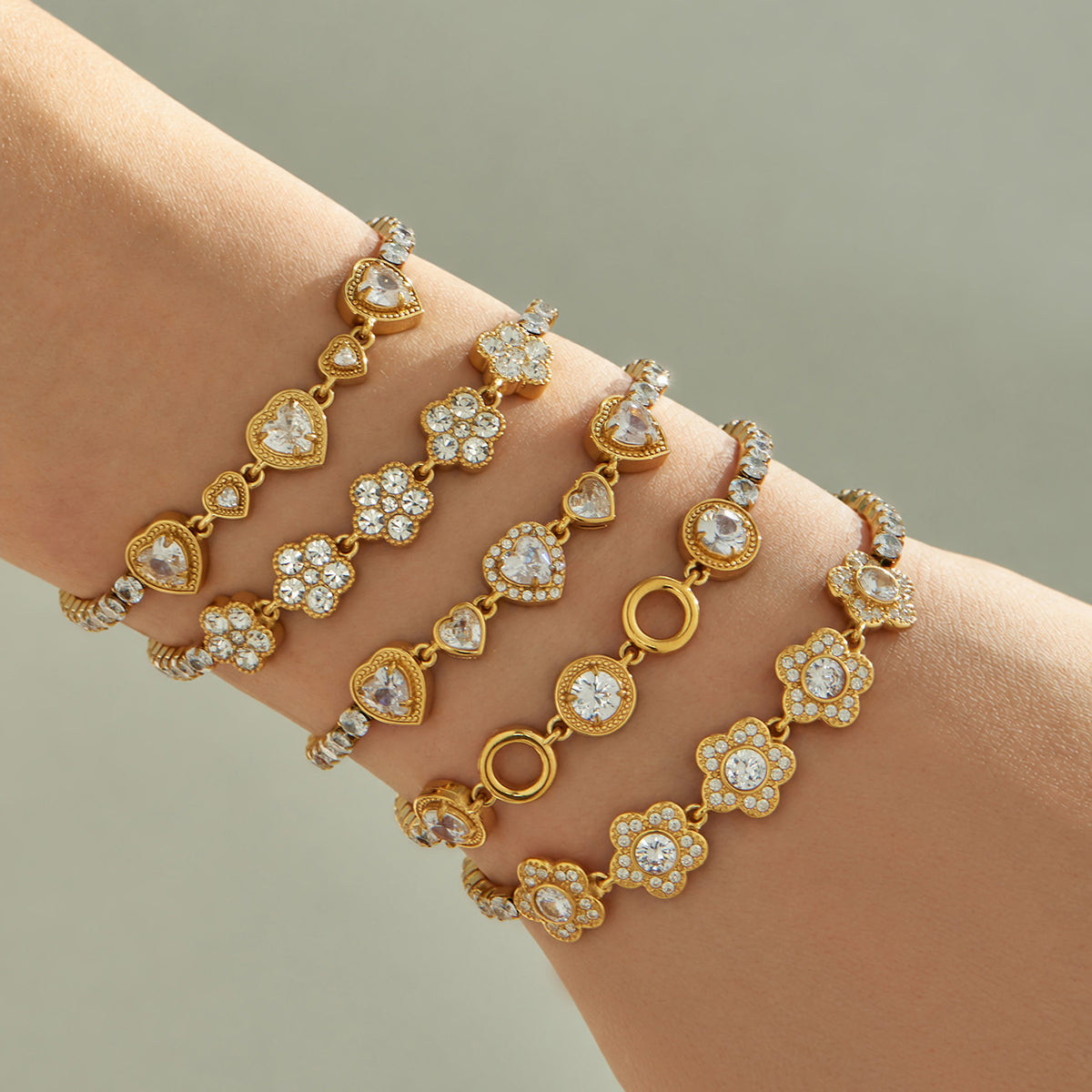 Gold zircon motif bracelets worn on wrist