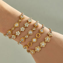 Gold zircon motif bracelets worn on wrist