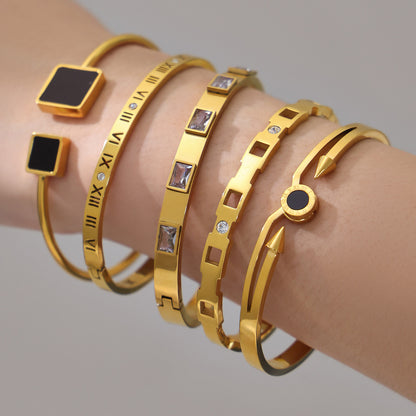 18k gold zircon stainless steel bangle set, layered on model's wrist