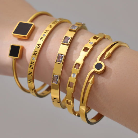 18k gold zircon stainless steel bangle set, layered on model's wrist