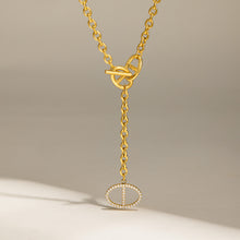 Gold zircon toggle drop necklace with front toggle closure and geometric pendant