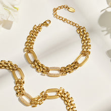 Gold zircon watch link bracelet flat lay showing structured chain design