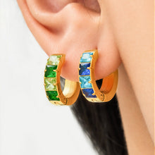 Gold-tone stainless steel hoop earrings with green and blue cubic zirconia accents