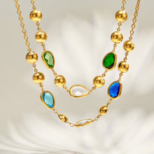 Green and blue glass stone necklaces layered together