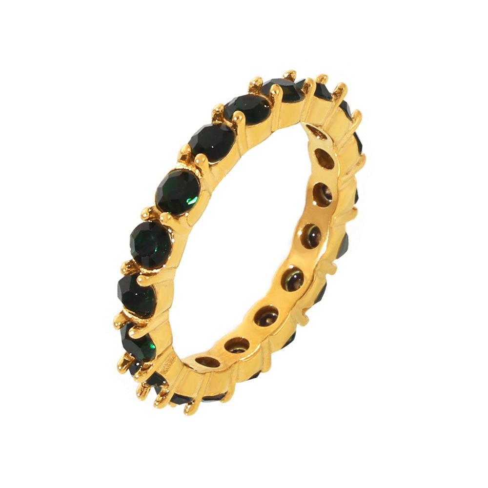 Green glass eternity ring in stainless steel with 18K PVD gold finish and full-circle stone design