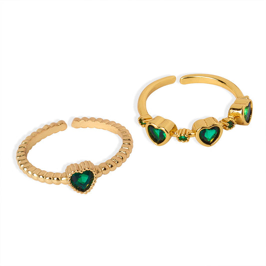Two 18K gold-plated copper ring styles with green heart zircon stones and clear accents