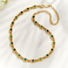 Green zircon chain necklace flat lay