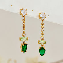 Pair of gold-tone drop earrings with green teardrop stones, clear upper studs and delicate gold-link chains