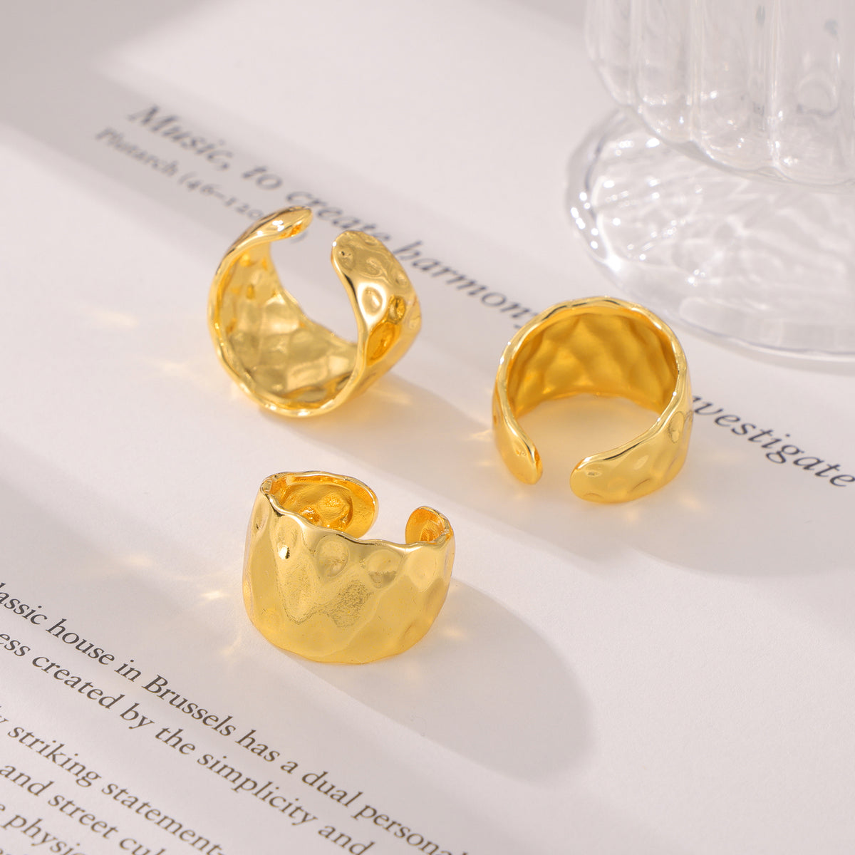 Hammered gold open rings displayed together in chunky statement styles