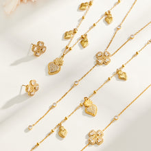 Heart and four-petal flower zircon necklaces, bracelets and earrings displayed in matching gold-tone styles
