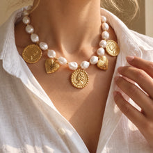 Heart and medallion beaded necklace styled at the collarbone