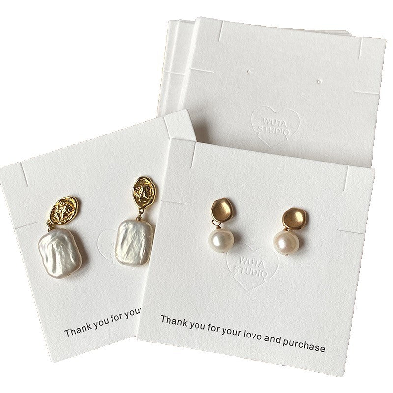 White jewelry display cards made from textured cotton paper for earrings and small jewelry