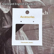 White accessories display card measuring 6.5 × 8 cm with cutout window