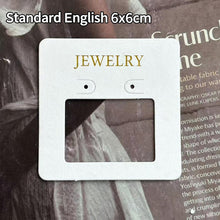 White 6 × 6 cm jewelry display card with window cutout and printed jewelry text
