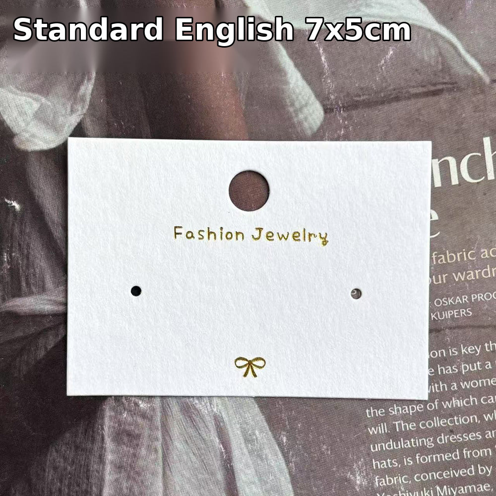 Standard English white jewelry display card measuring 7 × 5 cm