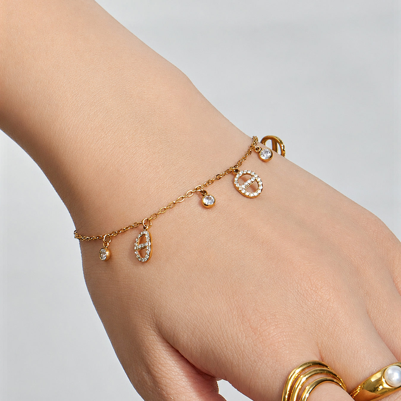 waterproof layered gold bracelet set made of stainless steel with coin charm details