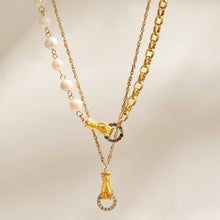 Layered freshwater pearl and gold chain necklaces with zircon connector and pendant details