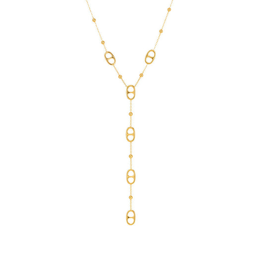 Gold tone layered stainless steel tassel necklace with long geometric drop chain on white background