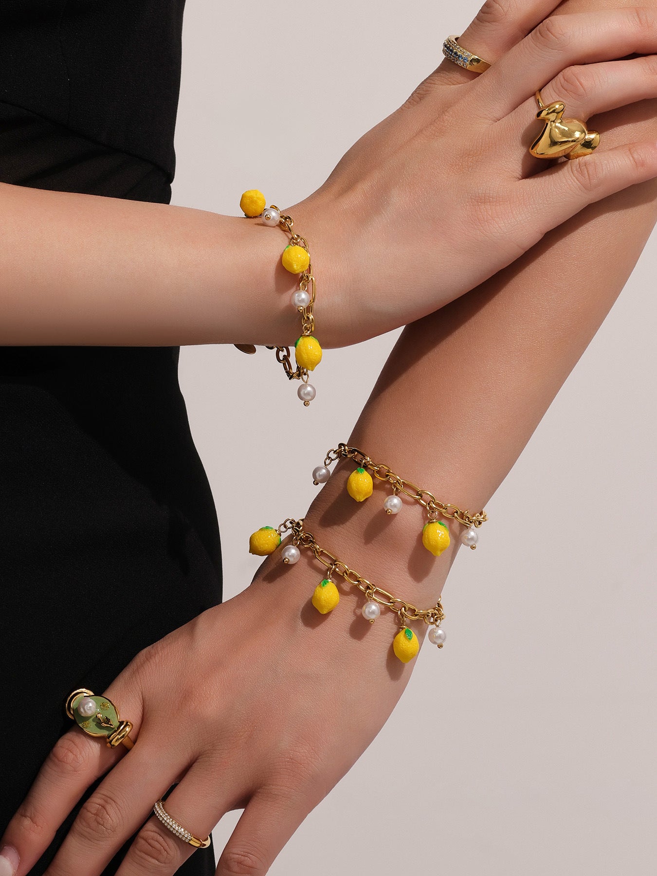 Close-up shot gold pearl lemon bracelet, lightweight comfortable summer women accessory