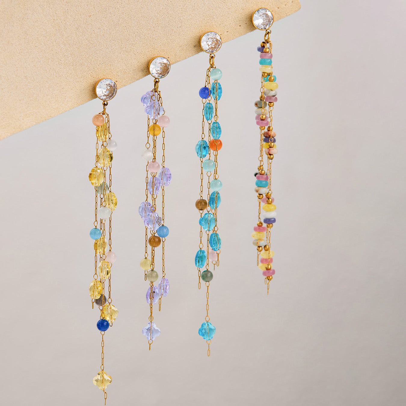 Long drop crystal earrings with geometric gemstone design