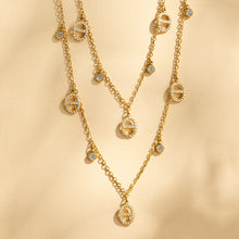 coordinated gold layered necklace and bracelet set for modern minimalist fashion style