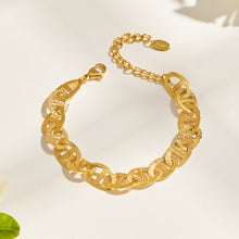 Gold mariner chain bracelet flat lay showing center-bar links