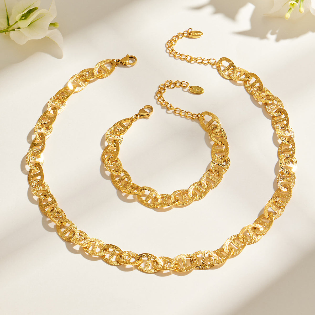 Mariner chain necklace and matching bracelet flat lay