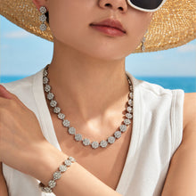 Matching zircon flower necklace worn by woman