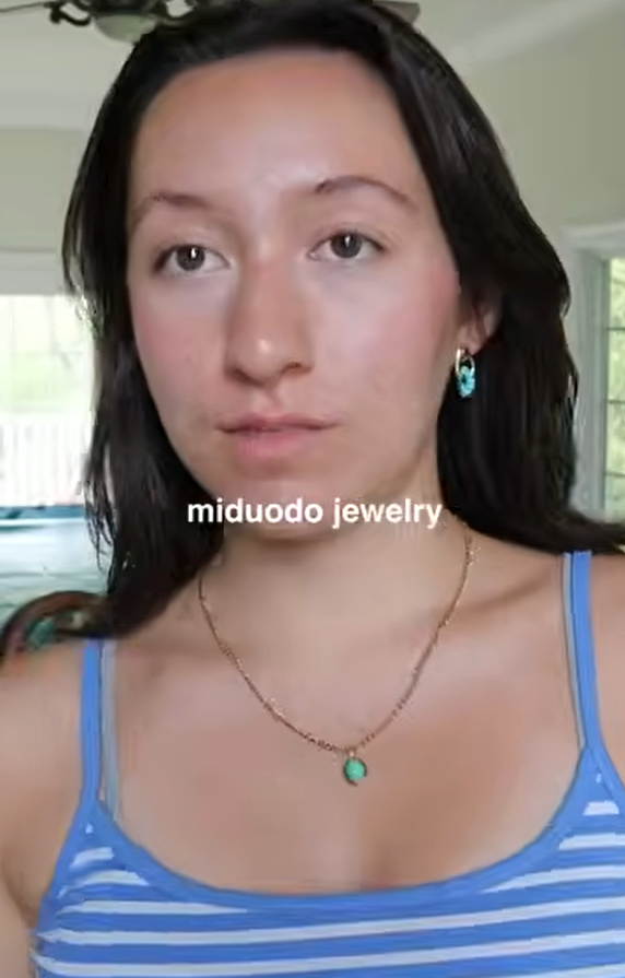 Brianna Jolie wearing a necklace and earrings in her Miduoduo jewelry haul