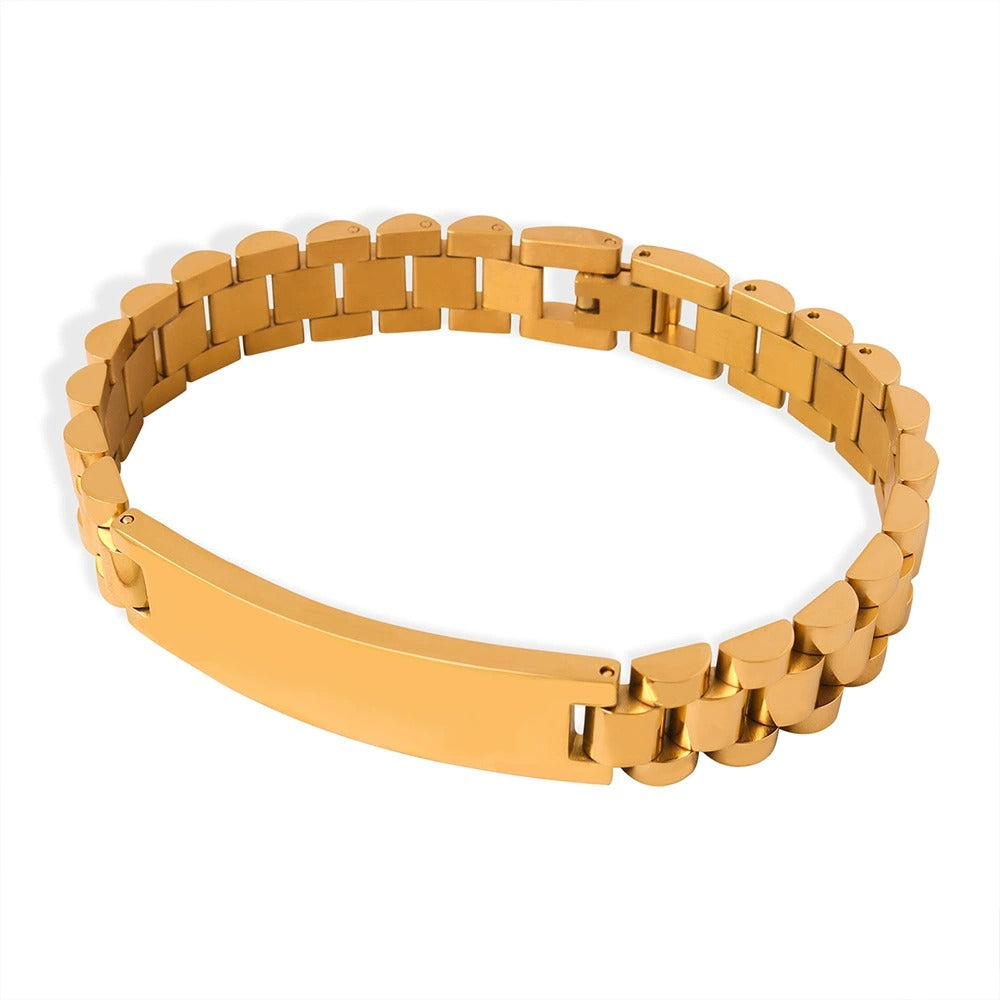 Men’s steel tone ID link bracelet on wrist with watch-band-style links and polished stainless steel finish