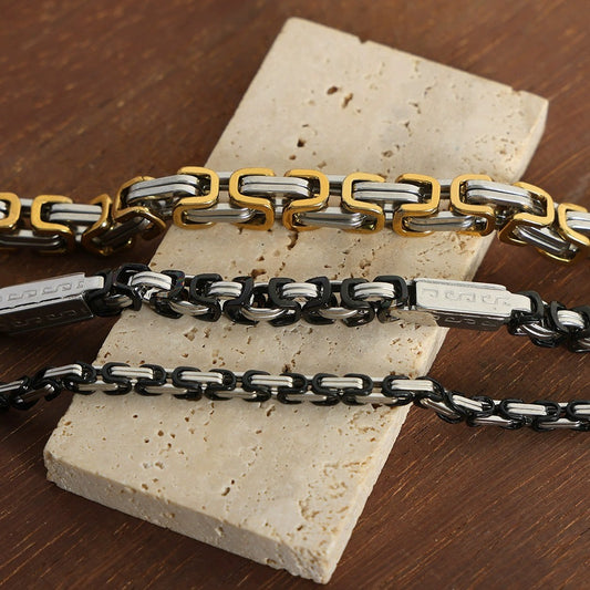 Men’s stainless steel link chain bracelet in gold steel, black steel and steel tone options for wholesale buyers