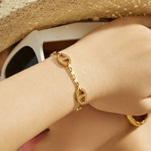 Gold D-shaped zircon bracelet worn on wrist in 316L stainless steel