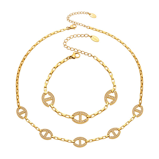 Gold D-shaped zircon necklace and bracelet set in 316L stainless steel by Miduoduo Jewelry