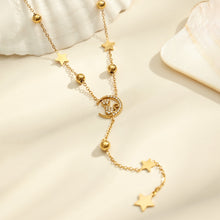 Close up of gold cat zircon Y necklace with star charm and dangling lariat pendant design